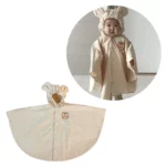 Poncho bébé capuche beige, motif animal mignon, oreilles sur capuche, idéal pour protéger et habiller bébé avec style.