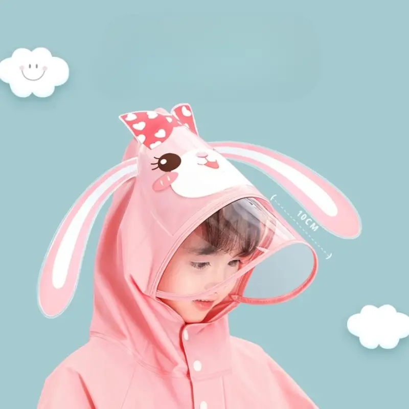 Poncho bébé coloré avec capuche lapin rose et visière transparente, idéal pour protéger les tout-petits de la pluie avec style.