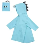 Poncho bébé dinosaure bleu imperméable avec capuche et motifs dinos, pratique et ludique, idéal pour protéger les enfants sous la pluie.