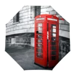 Parapluie anglais robuste avec motif cabine téléphonique rouge, allié parfait pour style et protection sous la pluie.