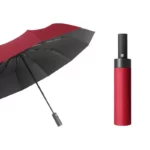 Parapluie anti retournement automatique, design compact rouge et noir avec étui, idéal pour une protection fiable contre la pluie.