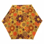Parapluie coloré hexagonal à motif floral vibrant, fleurs orange et beige sur fond jaune, allie style unique et protection pluie.