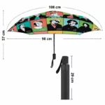 Parapluie vintage coloré avec portraits féminins célèbres, 108 cm ouvert, compact 29 cm fermé. Élégance rétro et utilité parfaite.