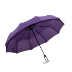 Parapluie tempête léger pliant violet, robuste et élégant, structure en métal, parfait pour affronter la pluie avec style.