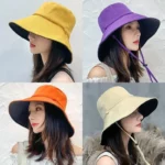 Chapeau de pluie bob souple femme, large bord, élégant et fonctionnel, décliné en jaune, violet, orange et beige, pour toute météo.