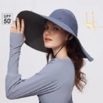 Chapeau de pluie femme gris, imperméable et anti-UV UPF 50+, à bord large, élégant et pratique pour protection solaire et pluie.