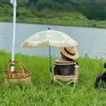 Parapluie poussette beige à franges pour bébé, idéal pour l'extérieur, élégant accessoire de la collection avec style et praticité.