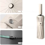 Parapluie pliant beige double baleines avec bouton métal, pliage câble vert et ouverture automatique élégante.