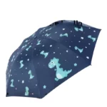 Parapluie enfant automatique bleu marine avec motifs dinosaures turquoise et étoiles blanches, parfait pour protéger les petits aventuriers.