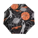 Parapluie enfant basketball pliant, motifs sportifs avec joueurs et ballons sur fond noir, pratique et stylé pour jeunes amateurs.