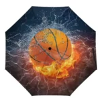 Parapluie enfant pliant basketball avec design sportif vibrant : ballon en feu, éclairs et éclaboussures pour jeunes passionnés.