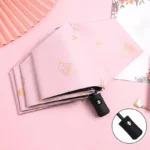 Parapluie enfant automatique pliant rose à motifs cœurs, pratique et stylé pour une protection contre la pluie.