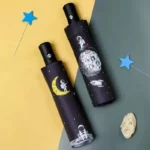 Parapluie enfant espace avec astronautes, fusées et lune, automatique et coloré, idéal pour les aventures sous la pluie.