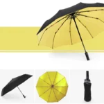 Parapluie automatique double couche noir et jaune, design moderne et pratique, idéal pour rester au sec avec élégance.