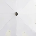 Parapluie beige automatique avec imprimé d'ours polaires, accessoire tendance et pratique pour une protection stylée contre la pluie.