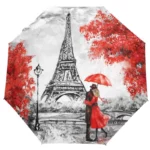 Parapluie pliant manuel 4 saisons avec design romantique : couple amoureux sous la Tour Eiffel à Paris, feuilles rouges, ambiance chic.