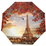 Parapluie pliant manuel Paris avec motif Tour Eiffel, idéal pour toutes saisons, design élégant inspiré de l'automne.