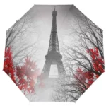 Parapluie pliant manuel Tour Eiffel 4 saisons, design branches noires et feuilles rouges, accessoire pratique et élégant.