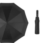 Parapluie tempête grand format noir, élégant et moderne, déplié à côté d'une version pliée compacte de la collection [Collection].