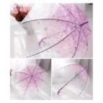 Parapluie transparent fleuri avec motifs roses et détails violets, élégant et pratique pour se protéger de la pluie avec style.