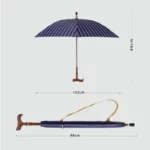 Parapluie canne élégant à rayures bleu marine et rose, poignée en bois, avec LED intégrée. Idéal pour style et praticité.