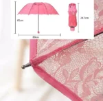 Parapluie rose transparent en dentelle avec motif floral, compact et repliable, idéal pour un style élégant par tous les temps.