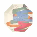 Mini parapluie manuel anti-UV pop art coloré avec motifs artistiques et message Colorful Life! pour illuminer les jours de pluie.