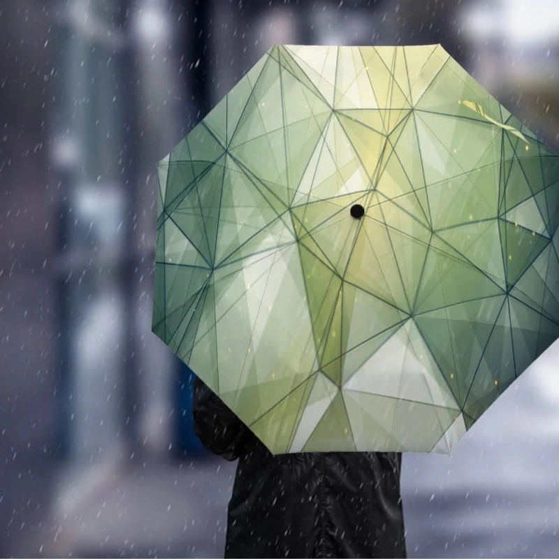 Parapluie automatique triangles verts, design élégant, motif géométrique, parfait pour la pluie en ville. Accessoire tendance.