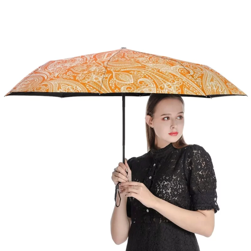 Parapluie automatique orange blanc rose anti-UV avec motif paisley, élégant et pratique pour protéger du soleil et de la pluie.