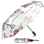 Parapluie chien automatique rose et blanc stylé, design floral unique, parfait pour la pluie et accessoire de mode tendance.