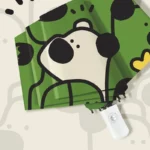 Parapluie chien automatique vert avec tête de toutou, design ludique et pratique, accessoire idéal pour les journées pluvieuses.