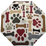 Parapluie chien manuel à motifs pattes, design ludique et tendance, parfait pour les amoureux d’animaux et des accessoires originaux.