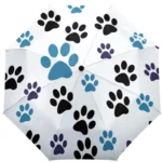 Parapluie chien manuel avec motifs pattes, design bleu, noir et violet sur fond blanc, élégant et original pour les amoureux des animaux.