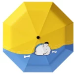 Parapluie pliant manuel bleu et jaune avec motif chien dessin animé et os, accessoire idéal pour illuminer les jours pluvieux.