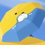 Parapluie pliant manuel bleu et jaune avec motif chien et os croisés, design ludique pour un style unique et protection efficace.