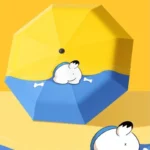 Parapluie pliant manuel chien bleu et jaune, motifs ludiques, accessoire original de la collection Paraluieo, design unique.