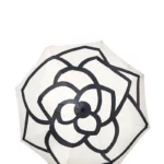 Parapluie noir beige motif fleur élégant, protection anti-UV, chic et fonctionnel, idéal contre la pluie et le soleil.