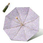Parapluie droit noir beige motif floral, protection anti UV élégante, accessoire chic pour pluie et soleil, avec étui vert inclus.