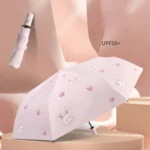 Parapluie lapin rose enfant anti-UV UPF50+ avec motifs pattes, automatique et stylé, idéal pour protéger du soleil et de la pluie.