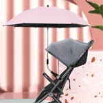 Parapluie poussette rose avec protection UV, monté sur poussette grise, parfait contre le soleil ou la pluie, design élégant.
