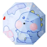 Parapluie poussette universel réglable anti-UV avec motif dinosaure bleu souriant, idéal pour protéger bébé avec style.