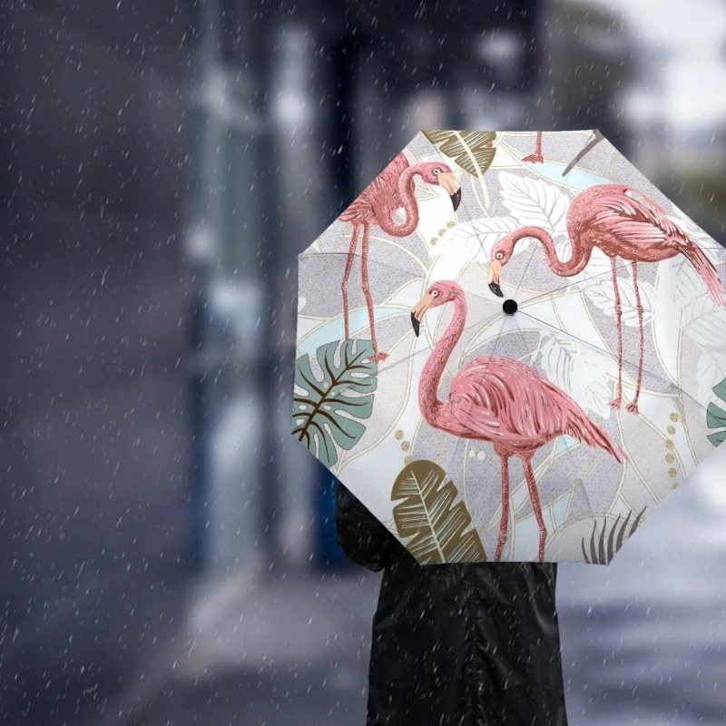 Parapluie automatique rose décoré de motifs de flamants roses, parfait pour un style élégant et fun sous la pluie.