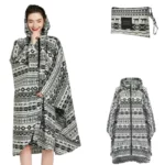 Poncho femme élégant à fermeture éclair, motifs géométriques noir et blanc, avec pochette assortie pour rangement pratique.