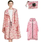 Poncho femme à fermeture éclair, design géométrique rose et blanc, imperméable avec pochette assortie, mode pratique et élégante.