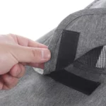 Toile protection poussette anti-UV grise, fenêtre transparente, rabat avec velcro pour protection pluie et soleil.