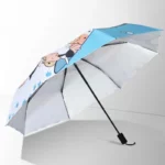 Parapluie manuel bleu et blanc à motif chat, anti-UV, design ludique avec empreintes, parfait pour rester stylé sous la pluie.