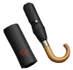 Parapluie pliant homme élégant noir, manche en bois, design raffiné, housse en cuir, idéal pour la collection [Collection].