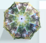 Parapluie rétro coloré avec un motif artistique de maisons et d'arbres, idéal pour un style vintage élégant et original.