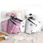 2 Très jolis parapluies automatiques rose et blanc à fleurs pour femme.