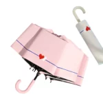 Joli parapluie rose manuel avec motif doube-coeur, on le trouve aussi en blanc, bleu, jaune et vert.